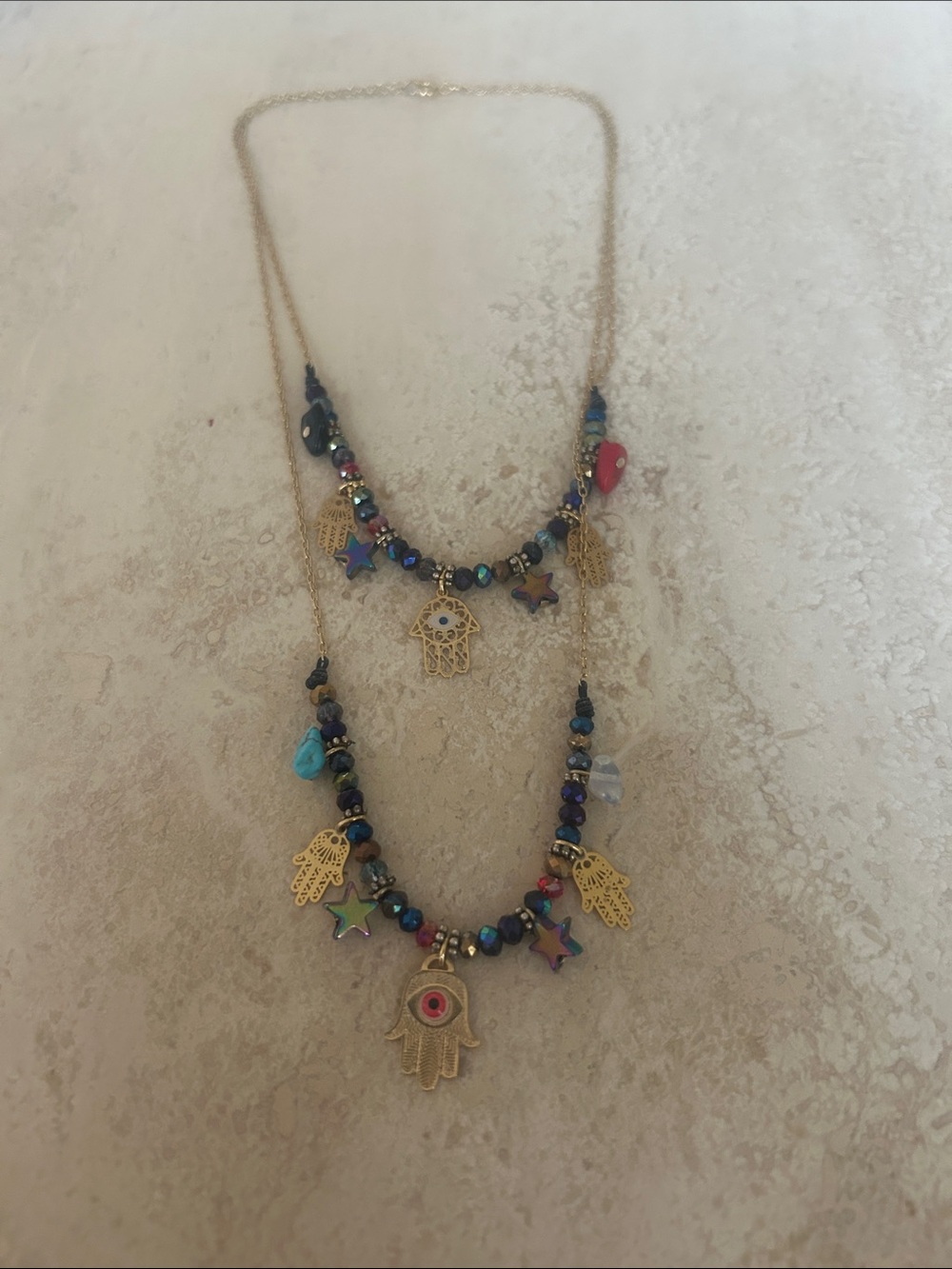 Floripondia from Colombia multi-layered charmed clasped necklace